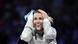 Olga Kharlan reacts by holding her hands to her head after a fencing victory Olga Kharlan reacts by holding her hands to her head after a fencing victory