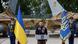 Ukraine's President Volodymyr Zelenskiy signs a national anthem next to two F-16 fighting aircraft Ukraine's President Volodymyr Zelenskiy signs a national anthem next to two F-16 fighting aircraft
