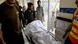 A man carries a body recovered from a bus crash in Kahuta, Pakistan A man carries a body recovered from a bus crash in Kahuta, Pakistan