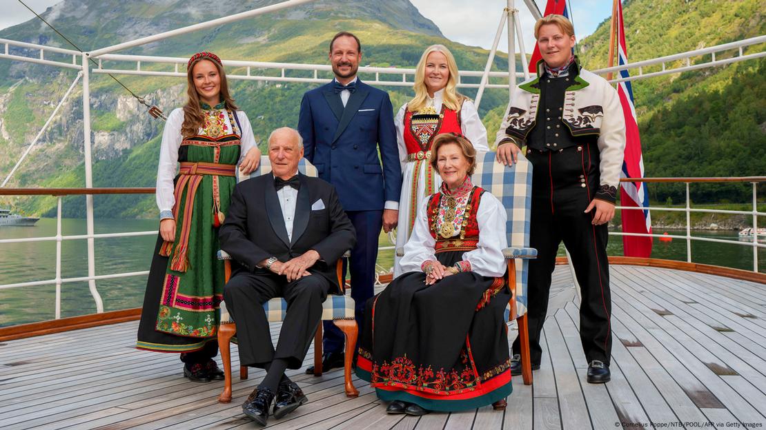 From left to right, anti-clockwise: Norwegian King Harald V, Queen Sonja, Prince Sverre Magnus, Princess Mette-Marit, Crown Prince Haakon and Princess Ingrid Alexandra posing for group photo on kingship Norway in the Geirangerfjord