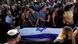 Relatives and friends mourn at a cemetery in Ra'anana during the funeral of hostage Almog Sarusi on Sept 1, 2024. Relatives and friends mourn at a cemetery in Ra'anana during the funeral of hostage Almog Sarusi on Sept 1, 2024.