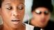 A woman reacts as a man behind her gives unwanted attention. A woman reacts as a man behind her gives unwanted attention.