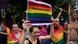 Protesters in Warsaw with LGBTQ+ flags and sign saying "Solidarity with Georgian LGBT community; We fight together #TbilisiPride" Protesters in Warsaw with LGBTQ+ flags and sign saying "Solidarity with Georgian LGBT community; We fight together #TbilisiPride"
