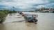 The Danube River in flood. In the background are a bridge, dark clouds and, on a hill, Bratislava Castle, Bratislava, Slovakia, September 2024 The Danube River in flood. In the background are a bridge, dark clouds and, on a hill, Bratislava Castle, Bratislava, Slovakia, September 2024