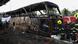 Firefighters work to extinguish a burning bus Firefighters work to extinguish a burning bus