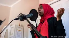 Munira Kaoneka, a podcaster from Tanzania, records her narration at a podcast training in Cape Town, South Africa