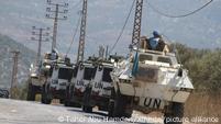 Lebanon: UNIFIL vehicles drive in a column along a road