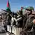 Houthi fighters are seen attending a military parade in Sanaa in September 2024