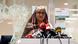 In this archive photo from July 25, 2024, Sheikh Hasina, at the time Bangladesh' prime minister, stands at a podium and addresses the media. A window in front of her is broken. In this archive photo from July 25, 2024, Sheikh Hasina, at the time Bangladesh' prime minister, stands at a podium and addresses the media. A window in front of her is broken.