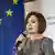 Moldovan President Maia Sandu speaking into a microphone during an event promoting a pro-EU referendum