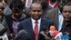 Kenya's interior minister Kithure Kindiki speaking in front of microphones Kenya's interior minister Kithure Kindiki speaking in front of microphones