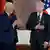 German President Frank-Walter Steinmeier applauds US President Joe Biden after awarding him Germany's Grand Cross special class of the Order of Merit.