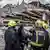 Rescuers standing in front of rubble where a building collapsed in Nairobi, Kenya