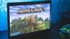 The Minecraft game is seen on a screen The Minecraft game is seen on a screen