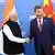 Modi and Xi Jinping, seen here shaking hands, agreed to boost cooperation to improve ties