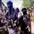 Boko Haram militants carrying various automatic weapons 