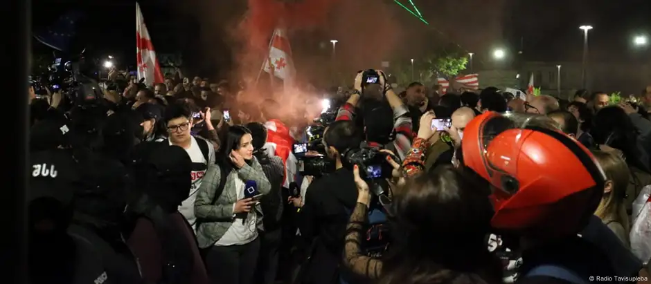 Protesters and journalists at a demonstration in Tblisi