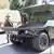 Казахстанский военнослужащий рядом с военной техникой