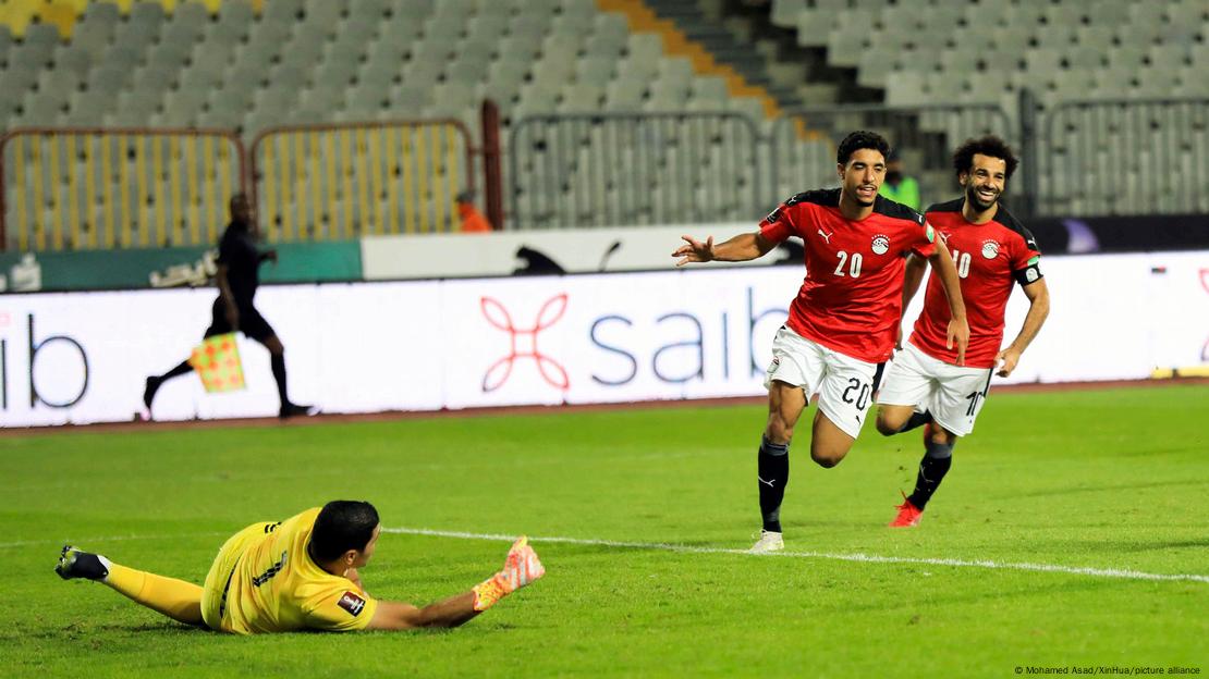 Egyptian players Omar Marmoush and Mo Salah celebrate.