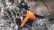 Rescue workers search for survivors in rubble Rescue workers search for survivors in rubble