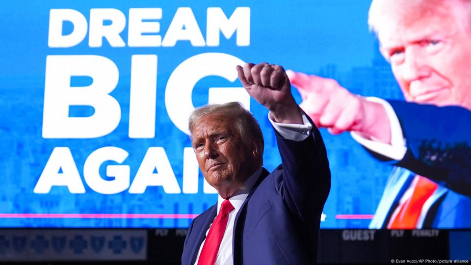 Republican presidential nominee former President Donald Trump gestures at a campaign rally at Van Andel Arena, Tuesday