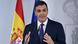 Prime Minister Pedro Sanchez stands in front of a Spanish flag as he speaks to reporters at a press conference Prime Minister Pedro Sanchez stands in front of a Spanish flag as he speaks to reporters at a press conference