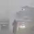  Tuk-tuk, bicycle, motorbike, buses and car seen through haze of smoke in Punjab on Nov 11, 2024.