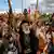 Supporters of Yemen's Huthis raise their rifles in the air as they chant slogans during an anti-Israel rally in solidarity with Gaza and Lebanon in the Huthi-controlled capital Sanaa.