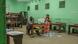 Des personnes attendent assises dans un bureau de vote de Libreville peint tout en vert (lors du référendum de novembre 2024) Des personnes attendent assises dans un bureau de vote de Libreville peint tout en vert (lors du référendum de novembre 2024)