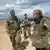 German Defense Minister Boris Pistorius speaks with German soldiers in Lithuania on May 22, 2024