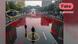 People walking on a street covered with a red liquid People walking on a street covered with a red liquid
