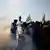 Farmers walk amidst tear gas as they march toward New Delhi to press for better crop prices at the Shambhu barrier, a border crossing between Punjab and Haryana states, India, December 6, 2024.