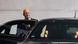 Olaf Scholz gets out of a black car Olaf Scholz gets out of a black car