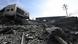 A man stands amid the rubble as parts of the Barzeh scientific research centre north of Damascus A man stands amid the rubble as parts of the Barzeh scientific research centre north of Damascus