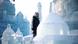 A boy standing among ice sculptures A boy standing among ice sculptures