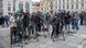 Georgia: Journalists gather with cameras in a central square, waiting for a statement