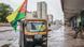 A tuk-tuk with a poster in the window of Mozambican opposition leader Venancio Mondlane and with a Mozambique flag attached to the side stands on a sidewalk in Maputo. A tuk-tuk with a poster in the window of Mozambican opposition leader Venancio Mondlane and with a Mozambique flag attached to the side stands on a sidewalk in Maputo.