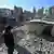 Man looks over rubble in Hammuriyeh, Eastern Ghouta, Syria on Jan 14, 2025.