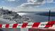 Blick auf einen Teil von Santorini - davor ein rot-weißes Absperrband Blick auf einen Teil von Santorini - davor ein rot-weißes Absperrband