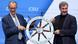Friedrich Merz (left) and Markus Söder hold up a ship's wheel, with the motto 'Bring Germany back on course' written on it Friedrich Merz (left) and Markus Söder hold up a ship's wheel, with the motto 'Bring Germany back on course' written on it