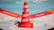 A traffic cone with the party logo of the Left Party (die Linke) written on it several times A traffic cone with the party logo of the Left Party (die Linke) written on it several times