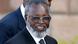Nujoma wears glasses and a tie as he smiles into the camera in this photo from 2004 Nujoma wears glasses and a tie as he smiles into the camera in this photo from 2004