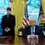 US President Donald Trump (right) sitting on his desk in the Oval Office while Elon Musk and his son X stand next to him