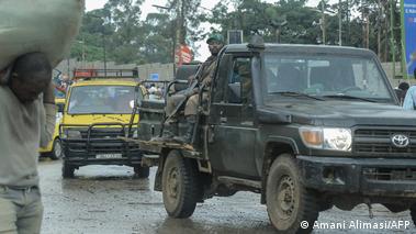 A soldier sits on the back of a pick-up truck as it drives through Bukavu 