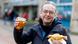 Michael Conrad from Duisburg, Germany, grabbed a beer and a sausage roll after casting his vote Michael Conrad from Duisburg, Germany, grabbed a beer and a sausage roll after casting his vote