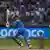 Virat Kohli flicks a ball to the leg side as Pakistan's wicketkeeper looks on