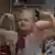 A still from 'Timestamp': children show how strong they are.