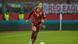 Giulia Gwinn dribbles the ball during a match against Austria, wearing a red kit and rainbow captain's armband Giulia Gwinn dribbles the ball during a match against Austria, wearing a red kit and rainbow captain's armband
