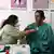 A doctor (L) examines a transgender woman at a free clinic for members of the transgender community in Hyderabad on January 28, 2023