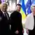  Wolodymyr Selenskyj (M.) mit EU-Ratspräsident Antonio Costa und EU-Kommissionspräsidentin Ursula von der Leyen vor Fahnen der EU und der Ukraine